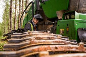 Papé Machinery technician performing preventive maintenance inspection on heavy construction equipment