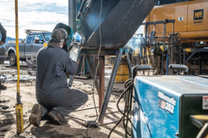 Scheduled preventive maintenance service reducing total cost of ownership for construction equipment