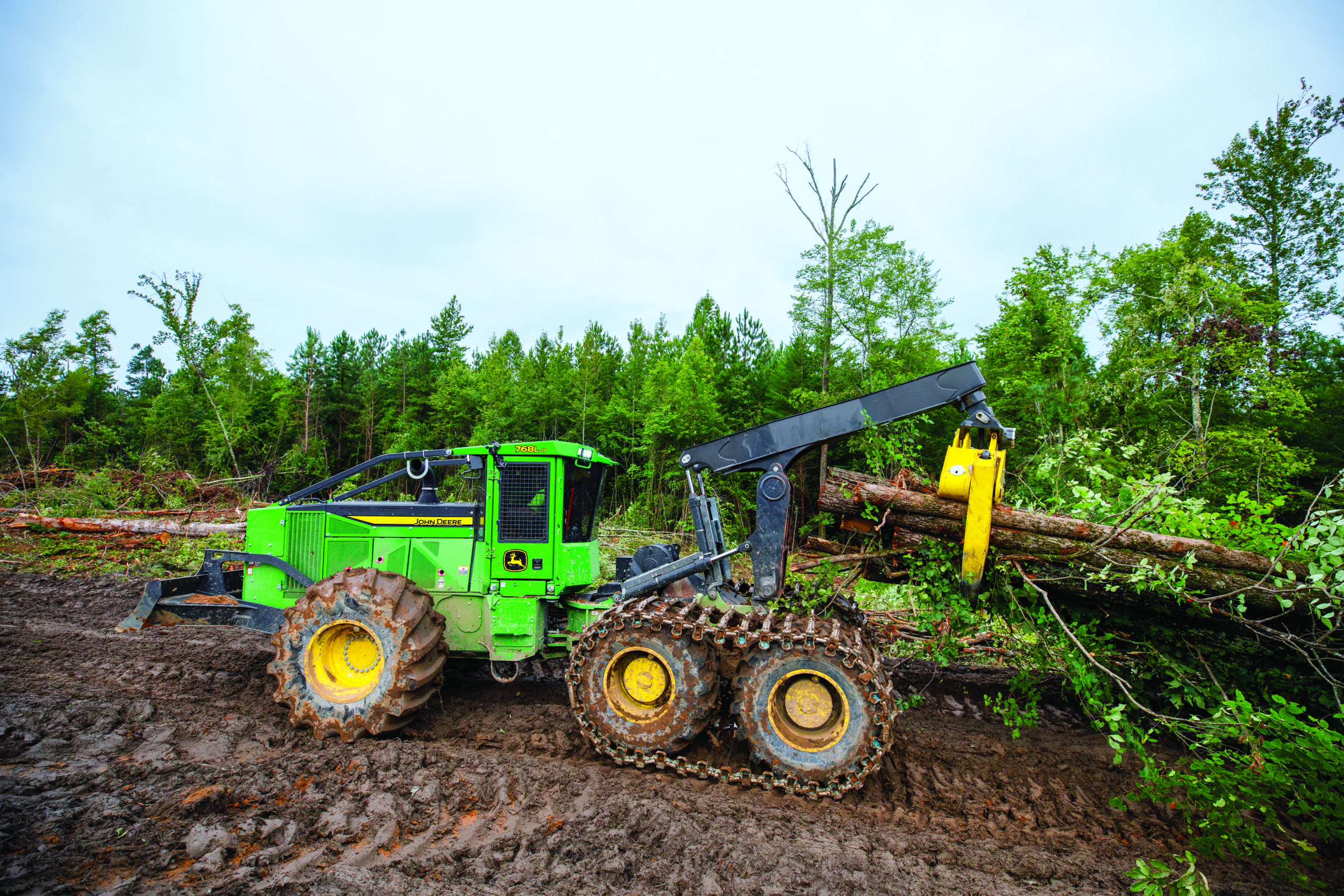 Construction and Forestry equipment in muddy worksite conditions getting an inspection
