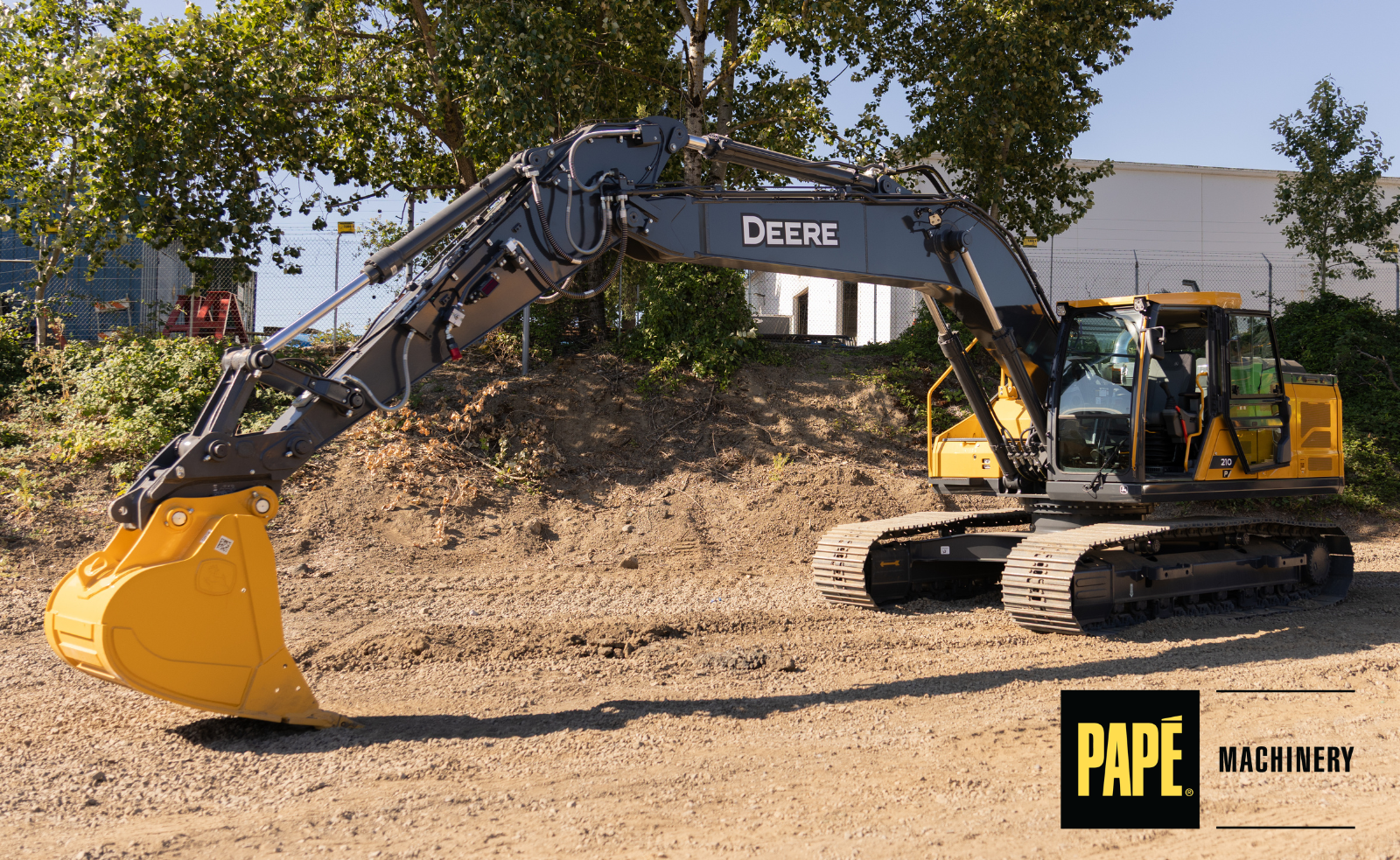 John Deere P-Tier mid-size excavator working on a construction site to improve productivity, grading accuracy, and excavation performance