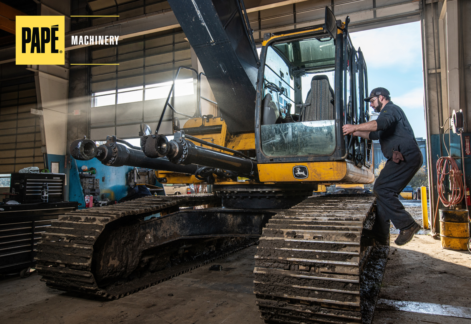 Papé Machinery technician servicing heavy equipment at a dealer service center